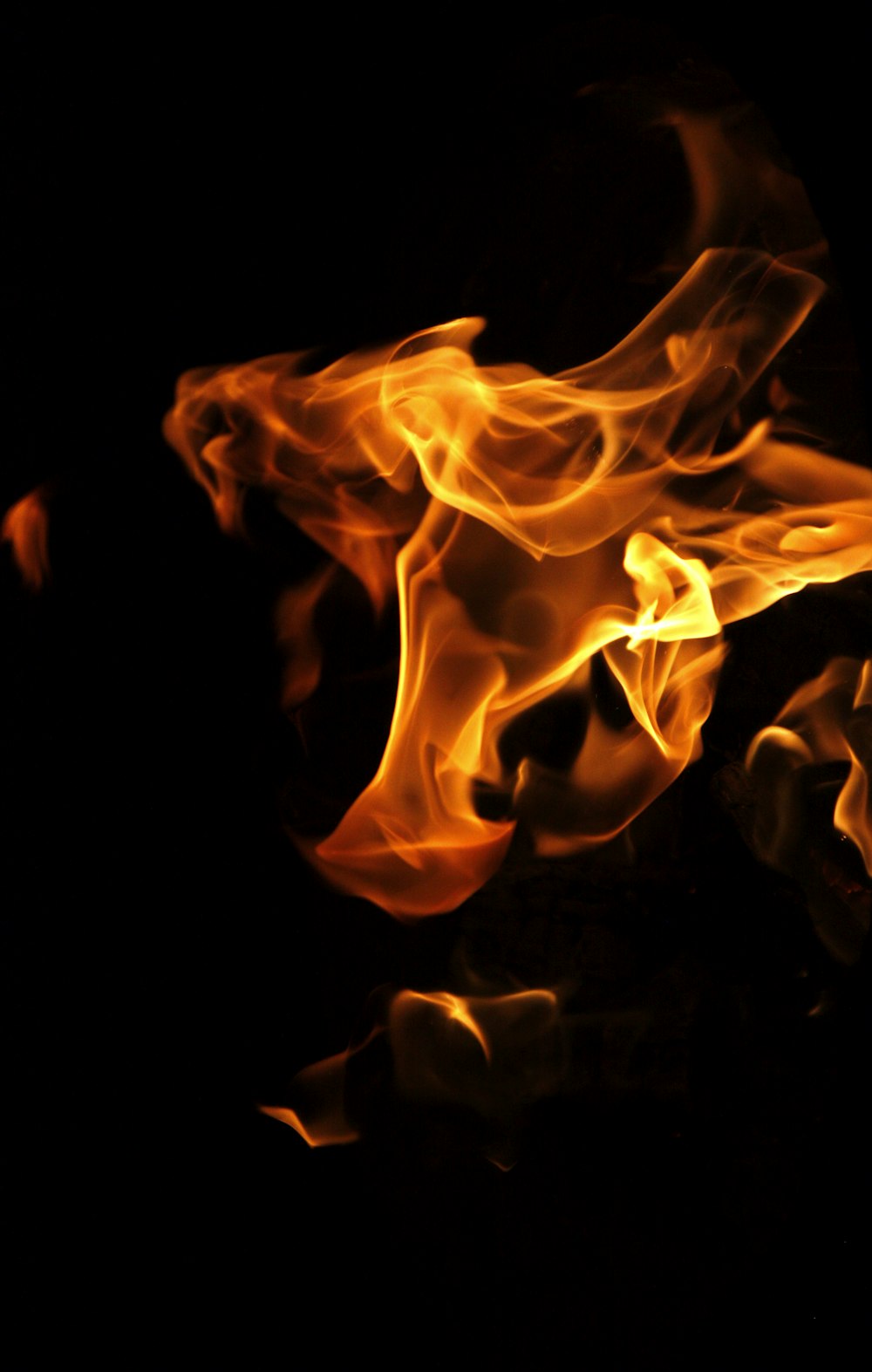 a close up of a fire on a black background