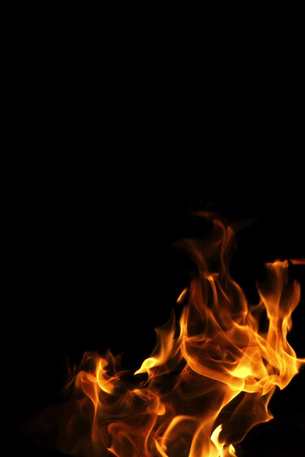 a close up of a fire on a black background