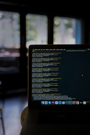 a laptop computer sitting on top of a table