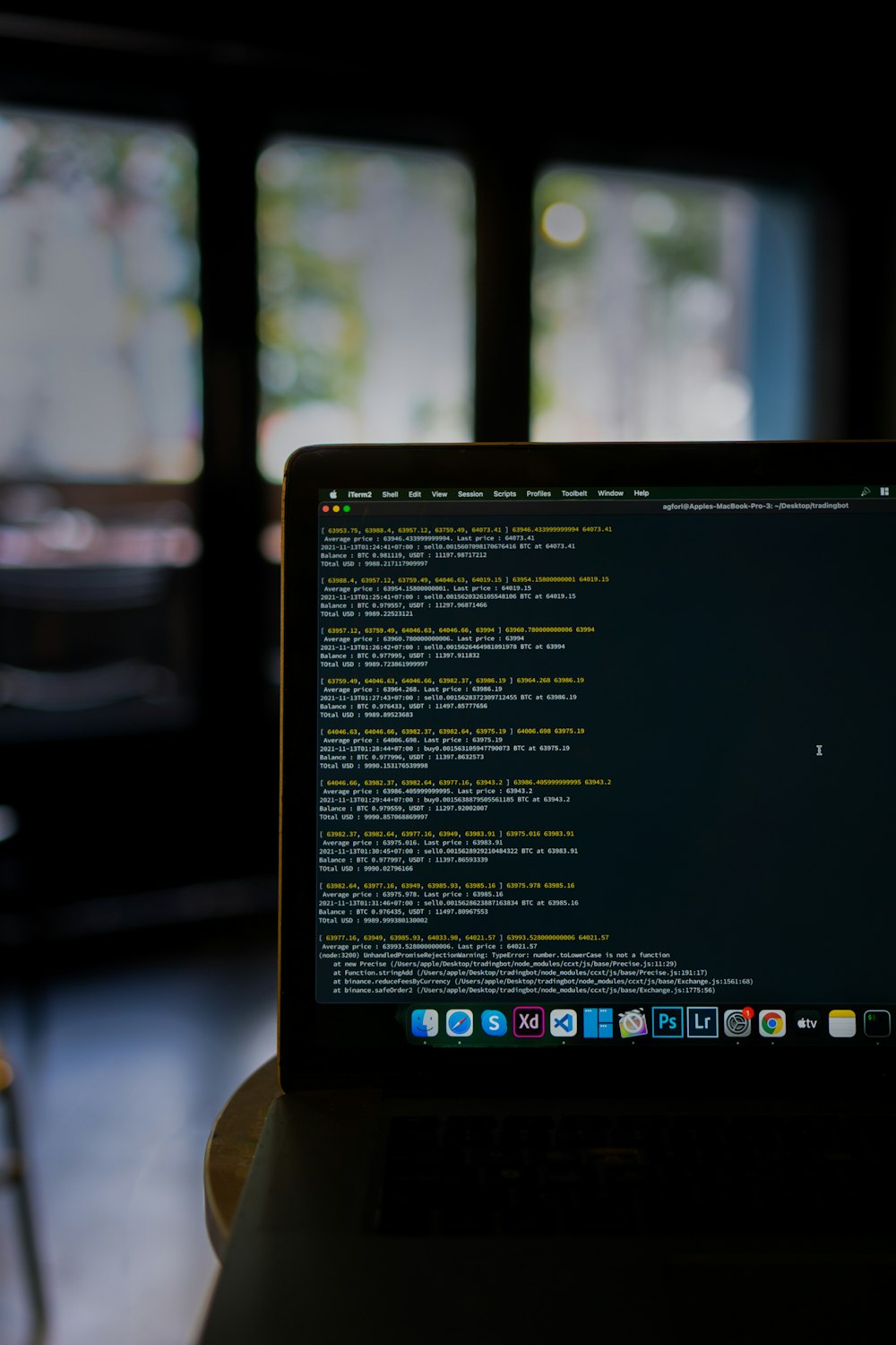 a laptop computer sitting on top of a table