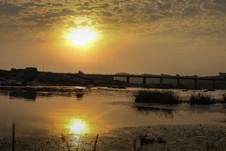 A warm sunset over a gently glowing bridge symbolizing connection and hope.