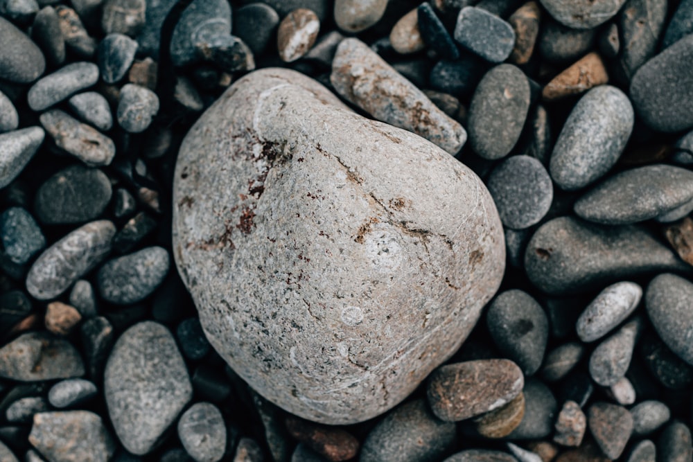 a rock sitting on top of a pile of rocks