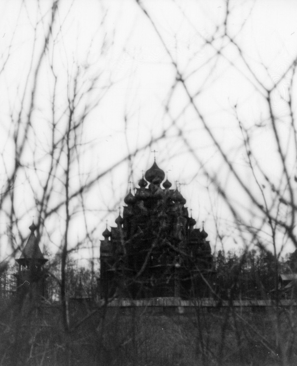 a black and white photo of a clock tower