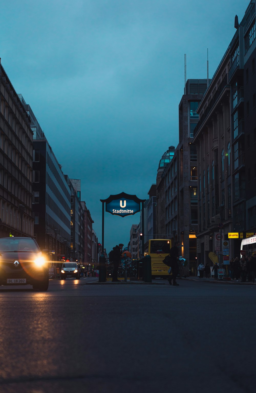 a car driving down a city street at night