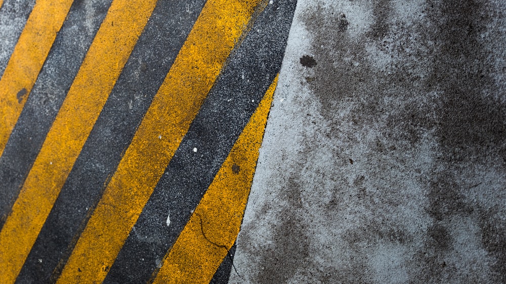 a close up of a yellow and black striped street