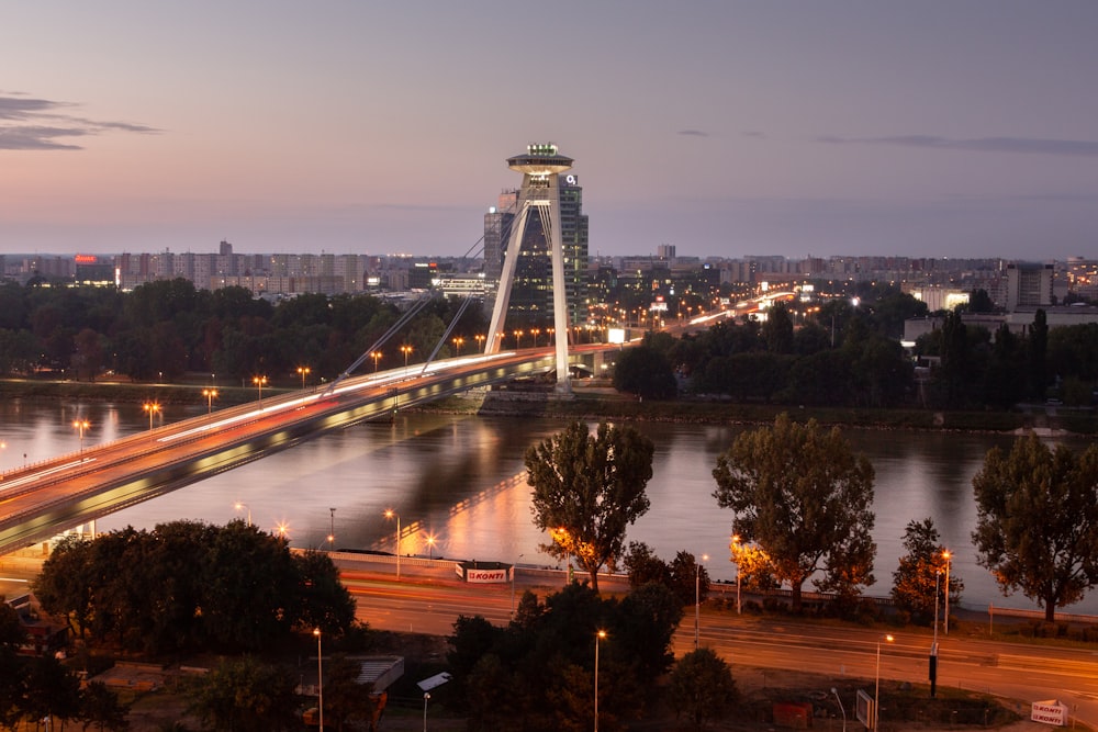 a view of a bridge over a river at night