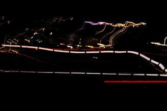 Abstract electric violet light trails symbolizing creative energy flow.