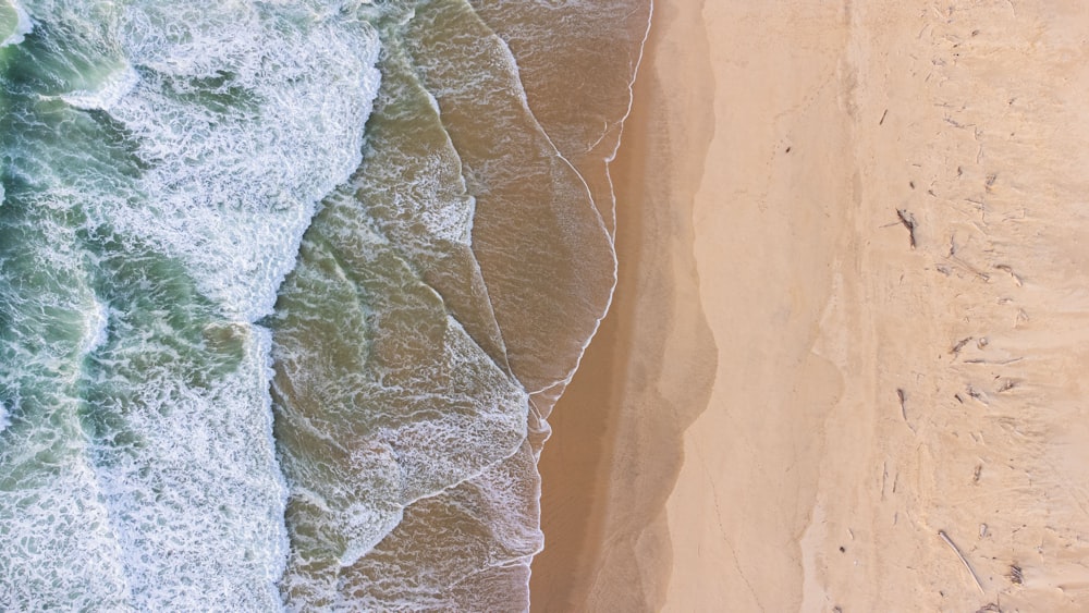 a bird's eye view of a beach and ocean