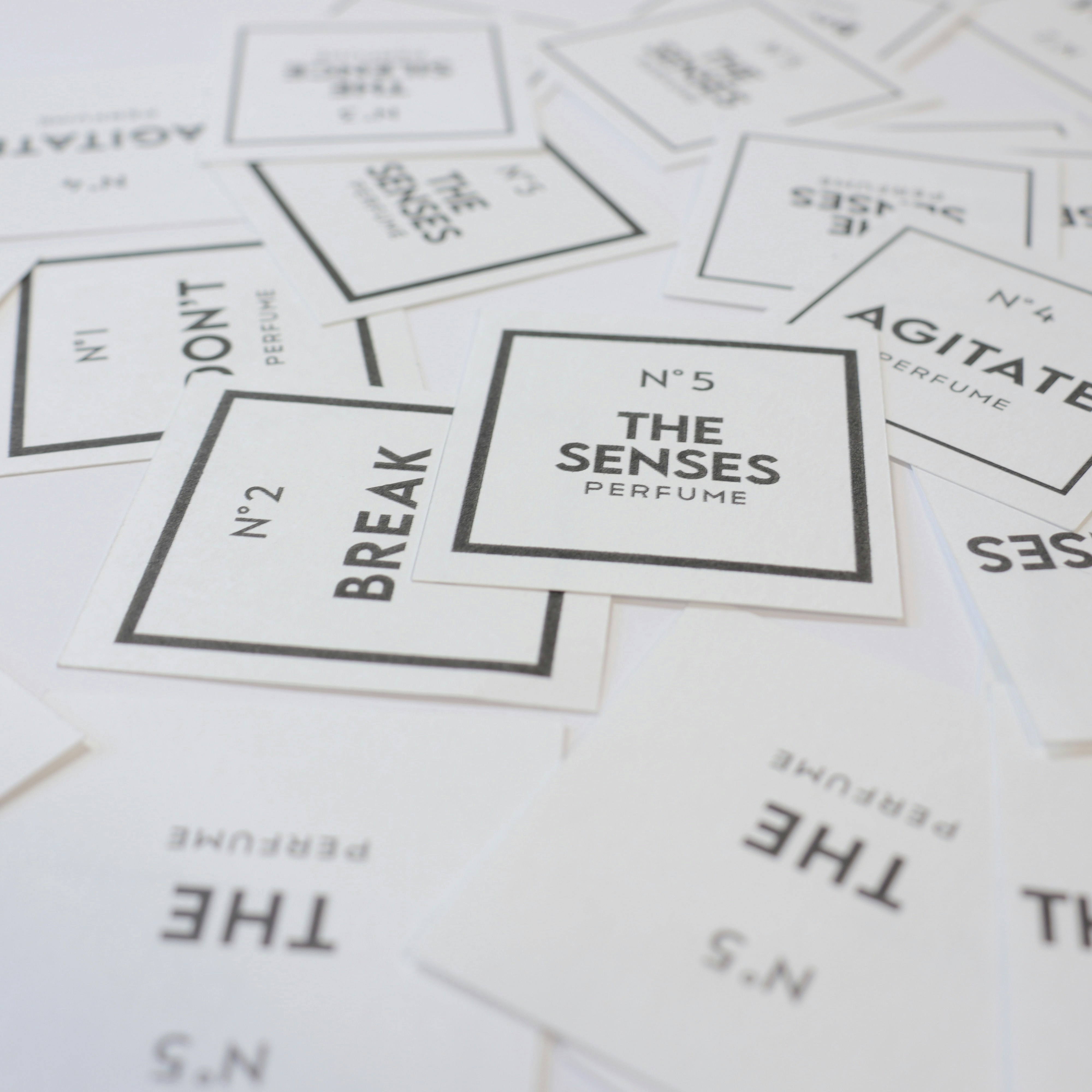 a pile of white business cards sitting on top of each other