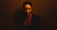 a woman in a dark room posing for a picture