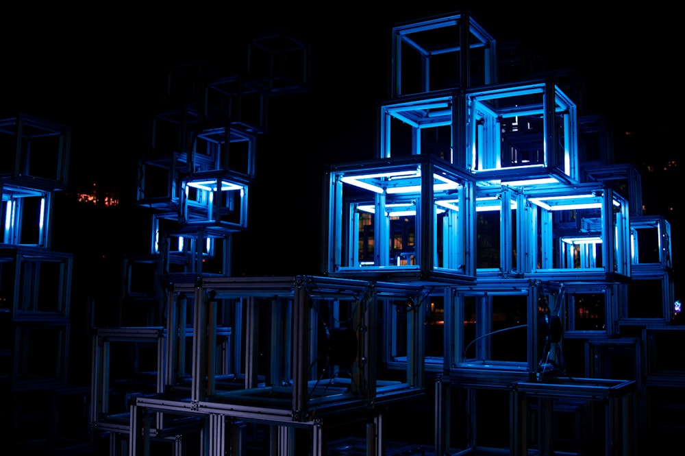 a group of cubes that are lit up in the dark