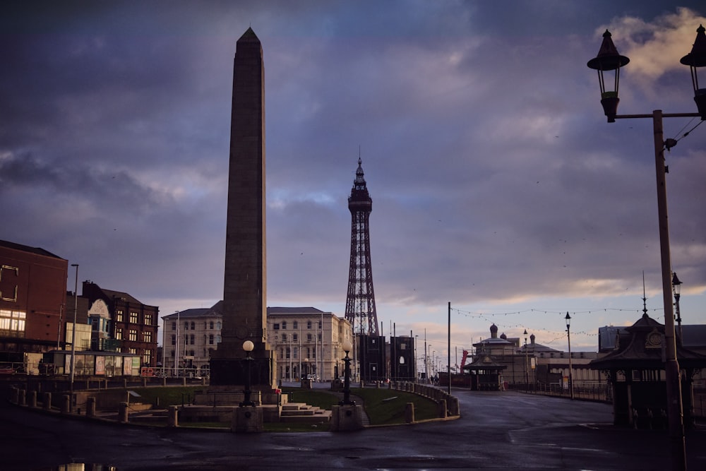 a very tall tower sitting in the middle of a street