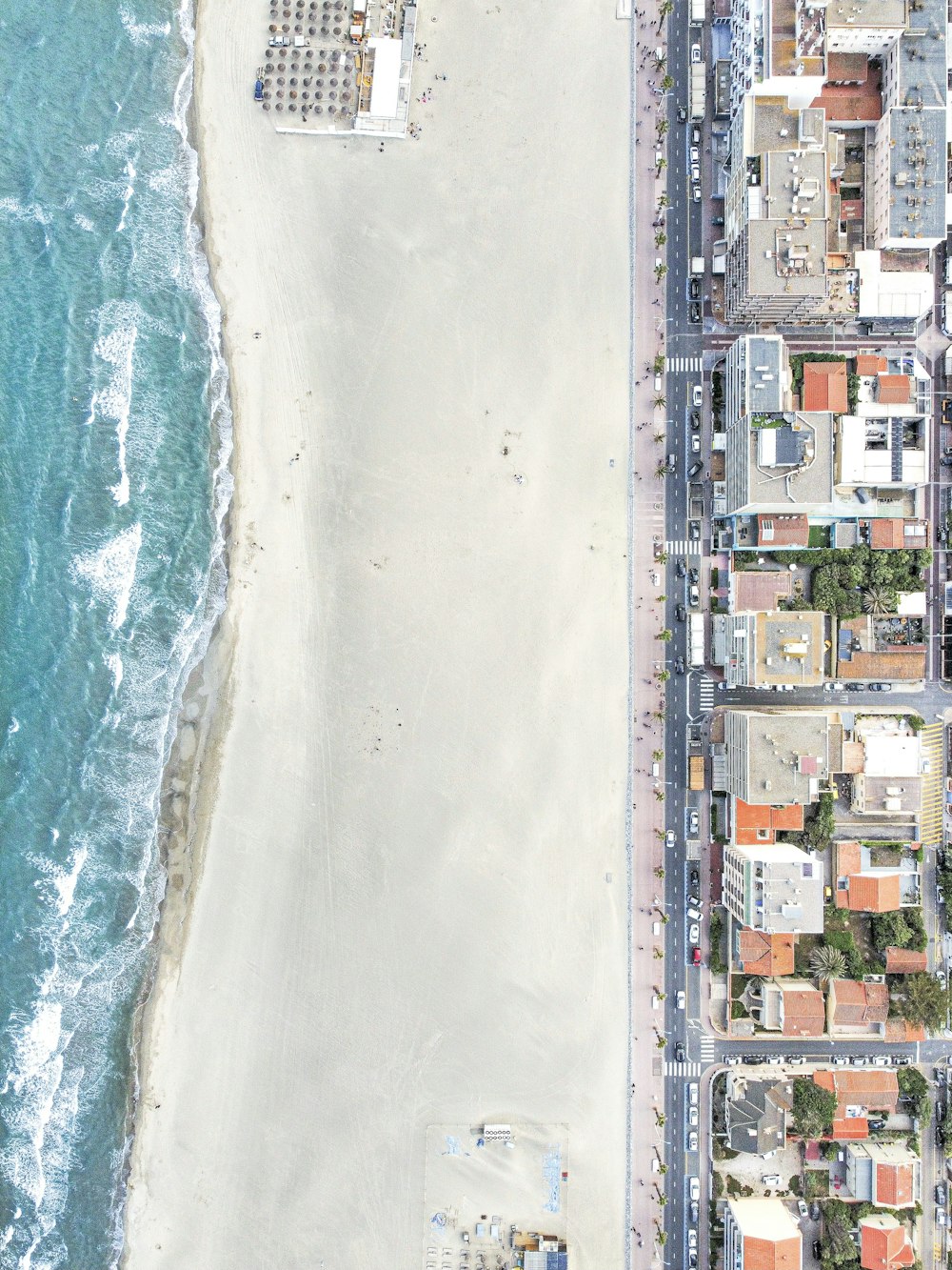 an aerial view of a beach and a city