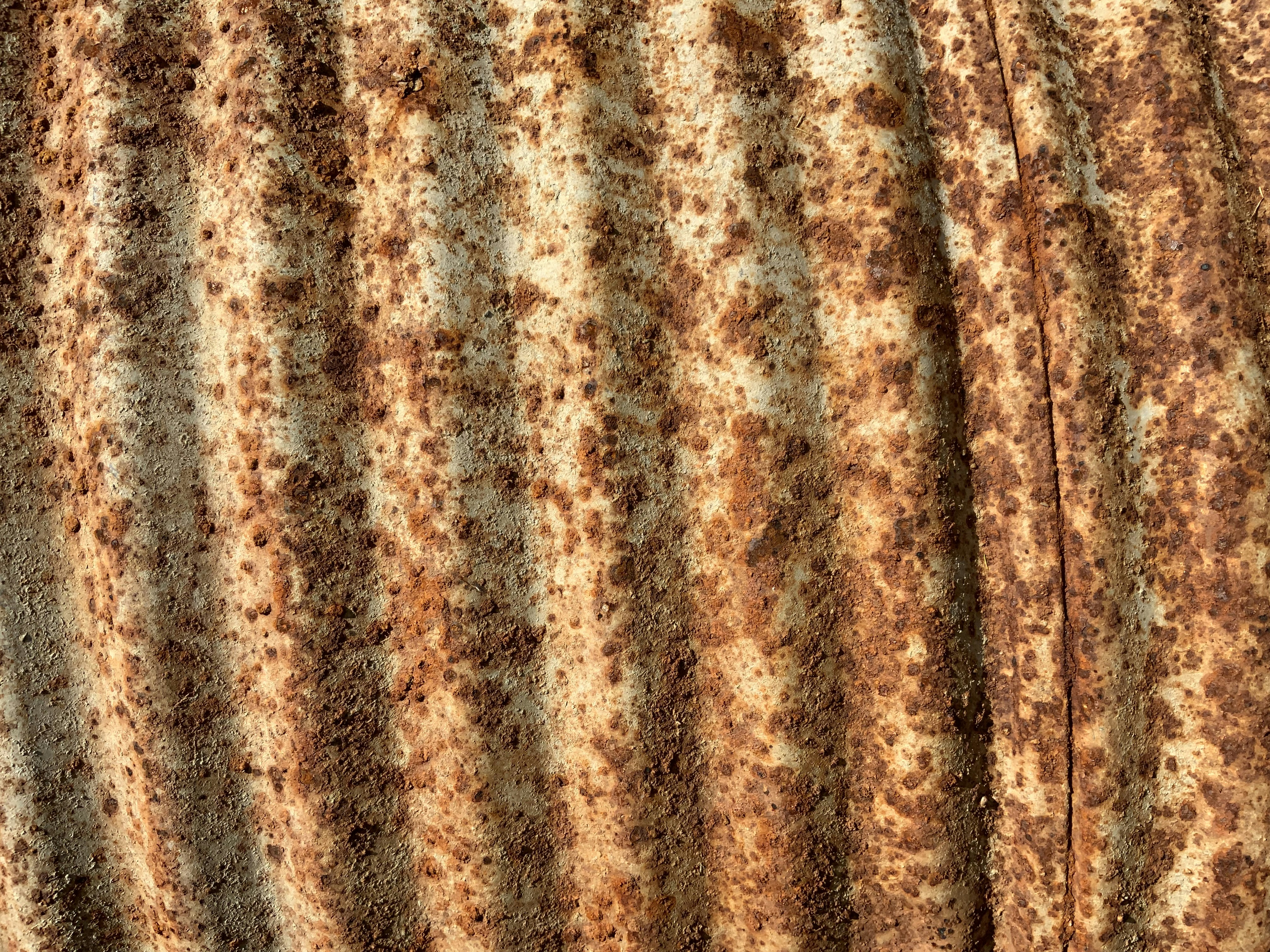 A close up of a rusted metal surface