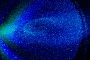 a blue and green background with stars