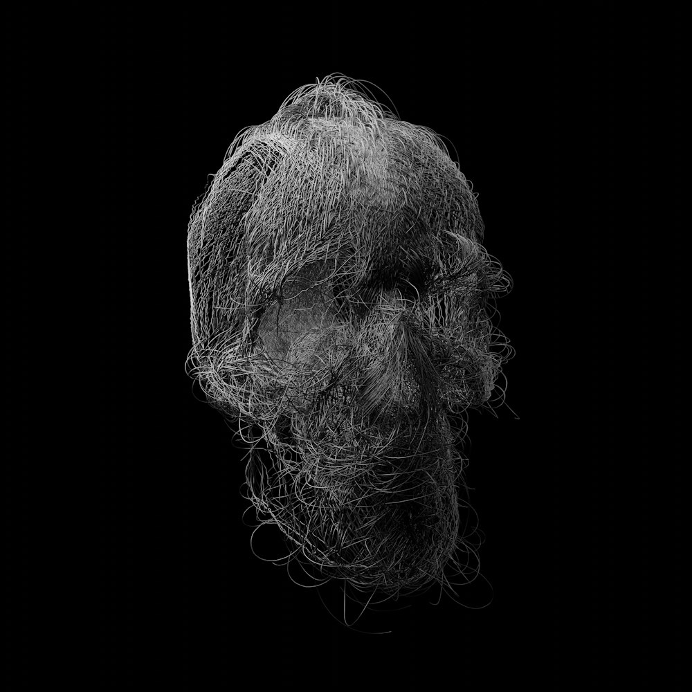 Una foto en blanco y negro de la cabeza de un hombre