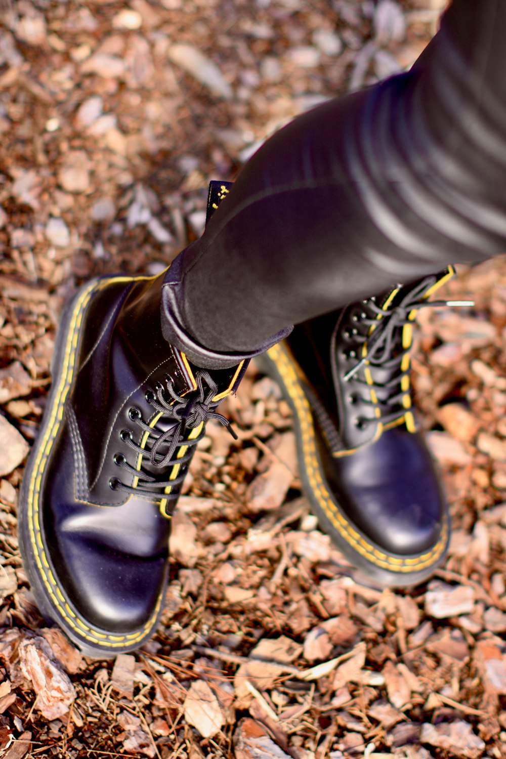 a close up of a person's legs and shoes