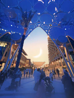 A panoramic shot of a bustling Saudi Arabian commercial district at sunset.