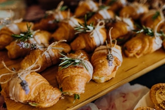 a wooden table topped with lots of pastries