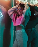 A male model from Borivili East wearing sleek pink-tinted sunglasses.