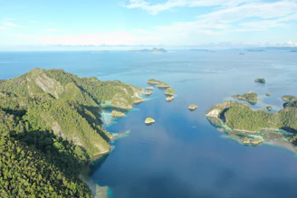 A serene aerial view of tropical islands surrounded by turquoise waters.