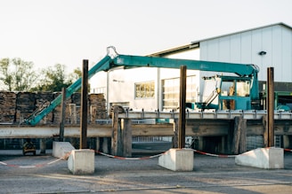 a large crane sitting next to a building