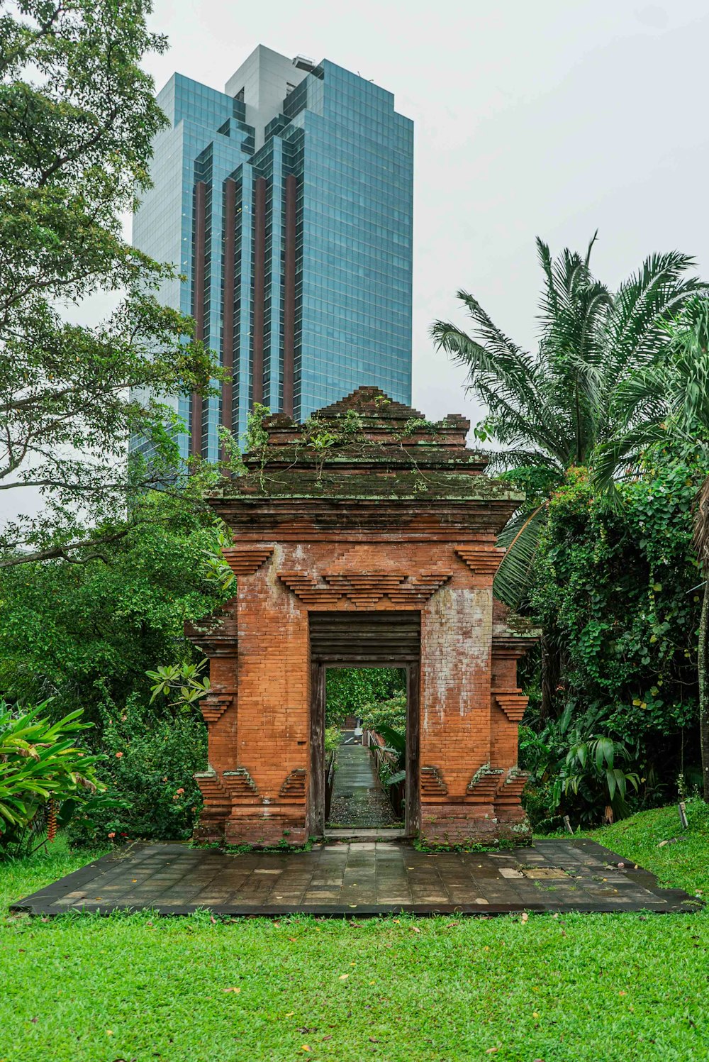 an old gate in the middle of a park