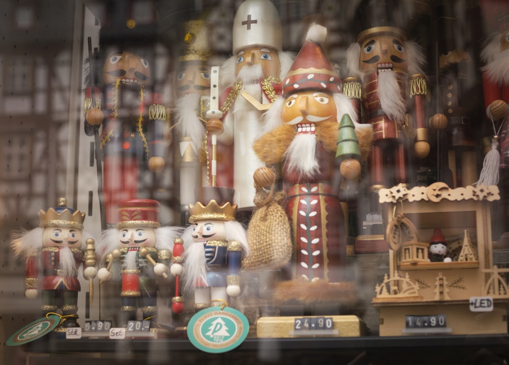 a bunch of nutcrackers are on display in a store window