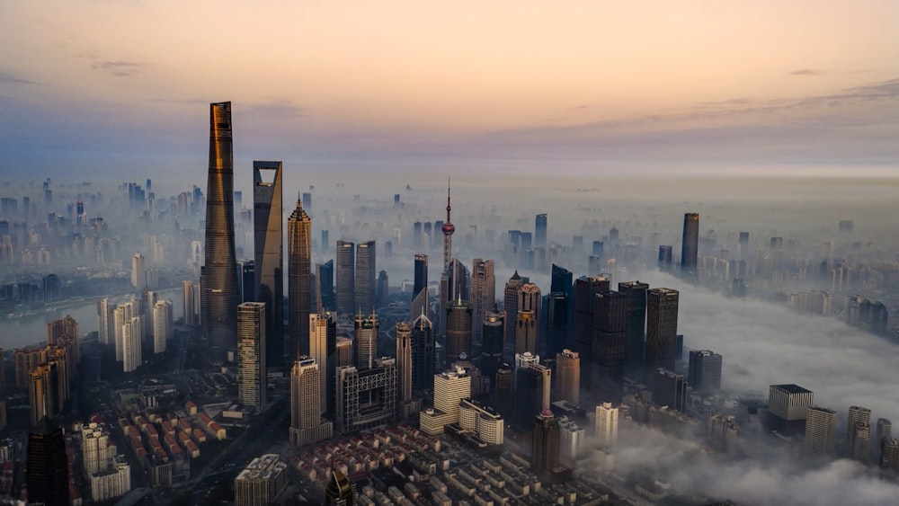 an aerial view of a city in the fog