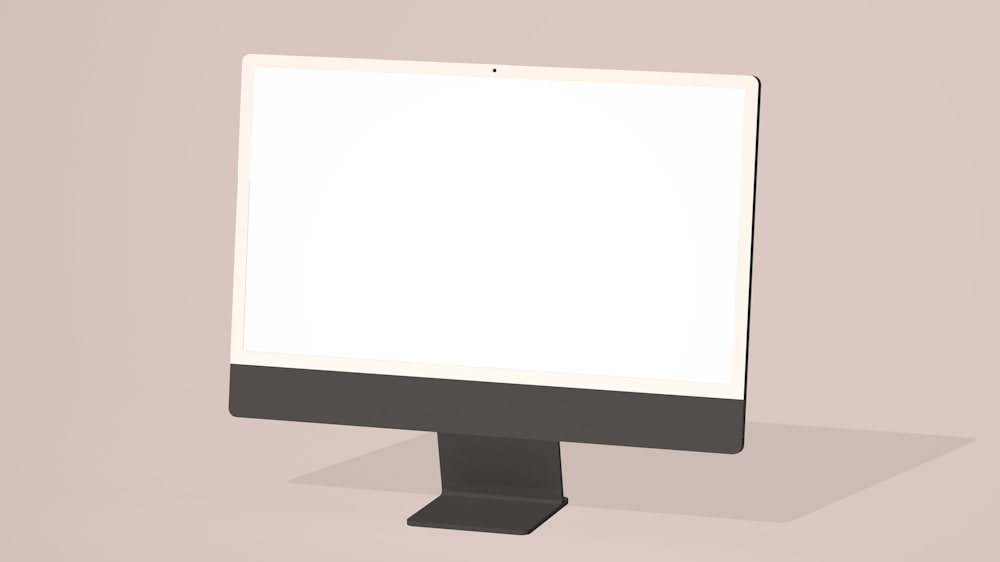a computer monitor sitting on top of a table