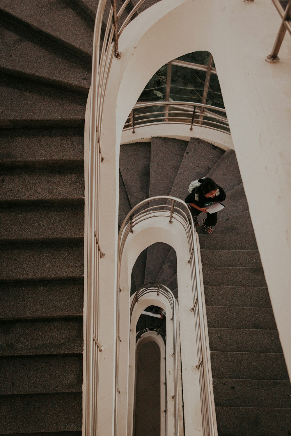 a man riding a skateboard down a set of stairs