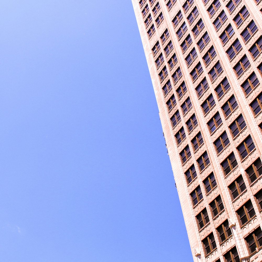 a very tall building with a clock on it's side