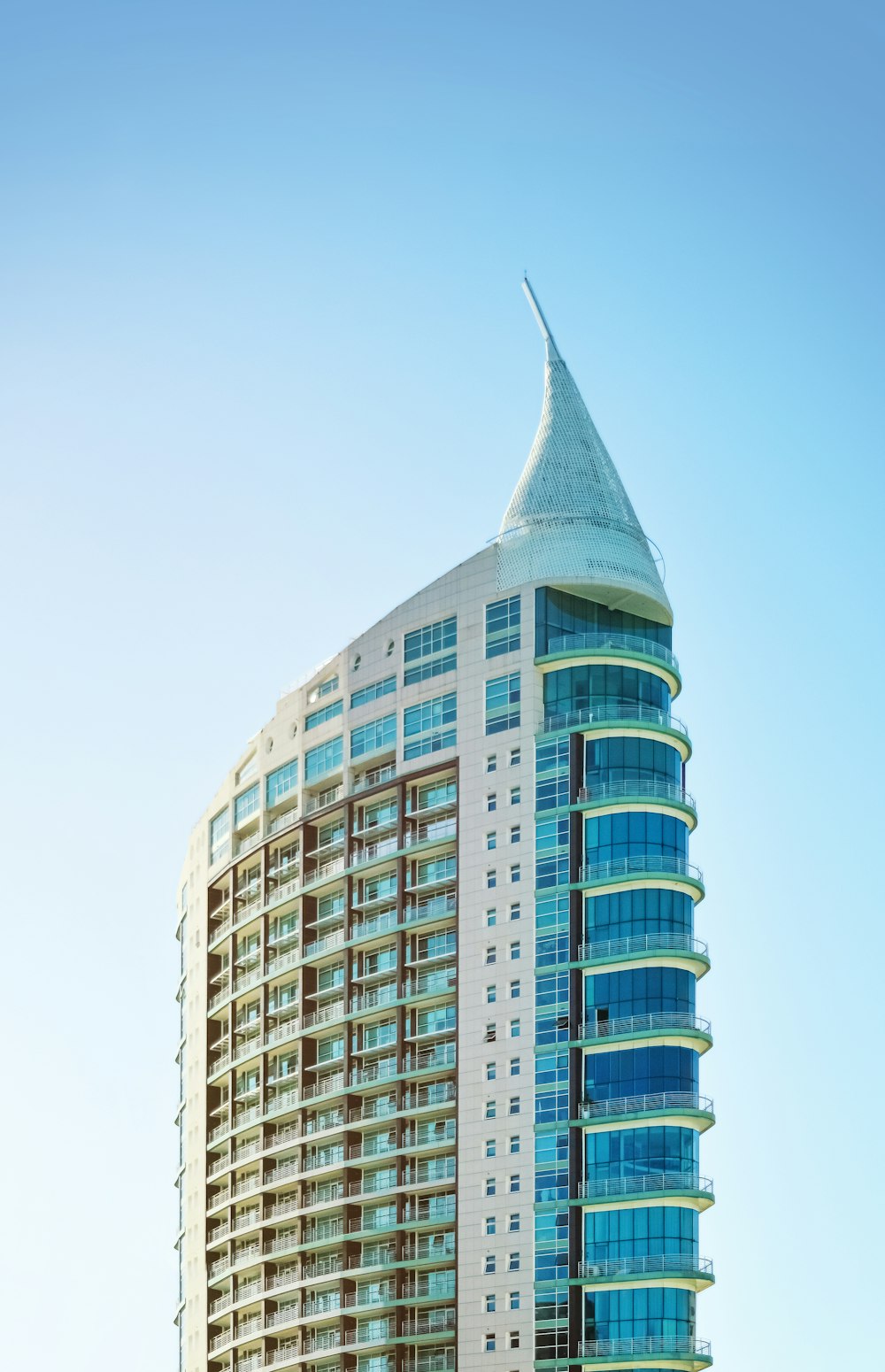 a very tall building with a sky background