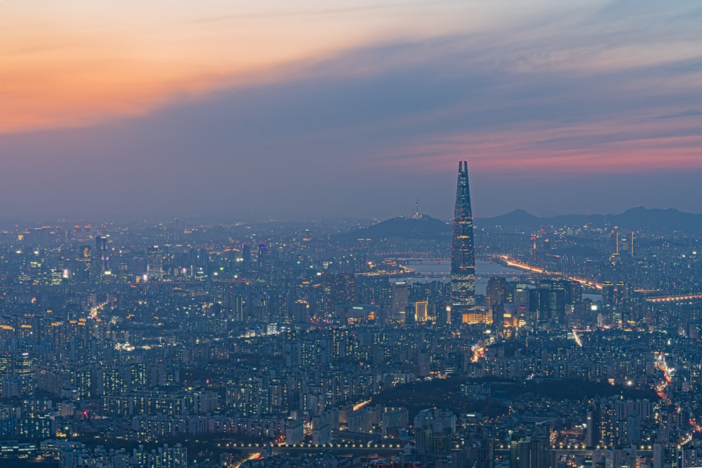 a view of a city at night from the top of a building