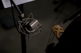 a close up of a microphone and a guitar