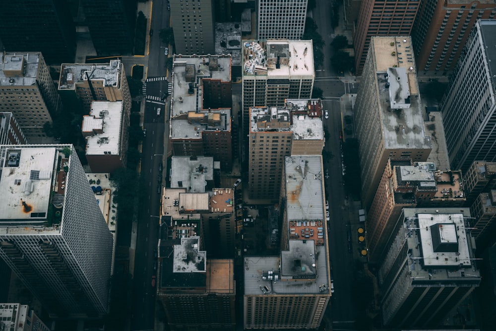 an aerial view of a city with tall buildings