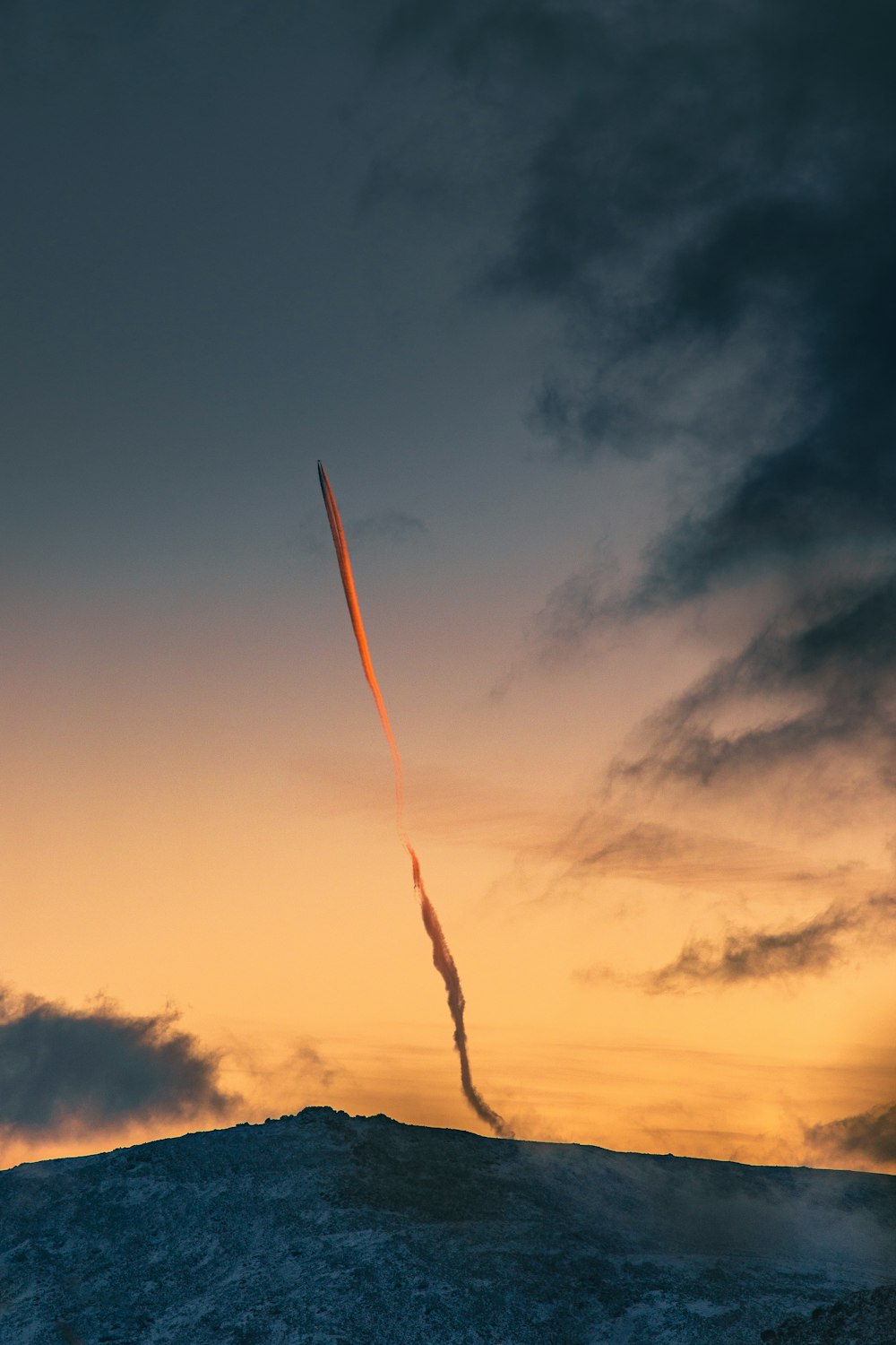 a long tail of an object flying in the sky