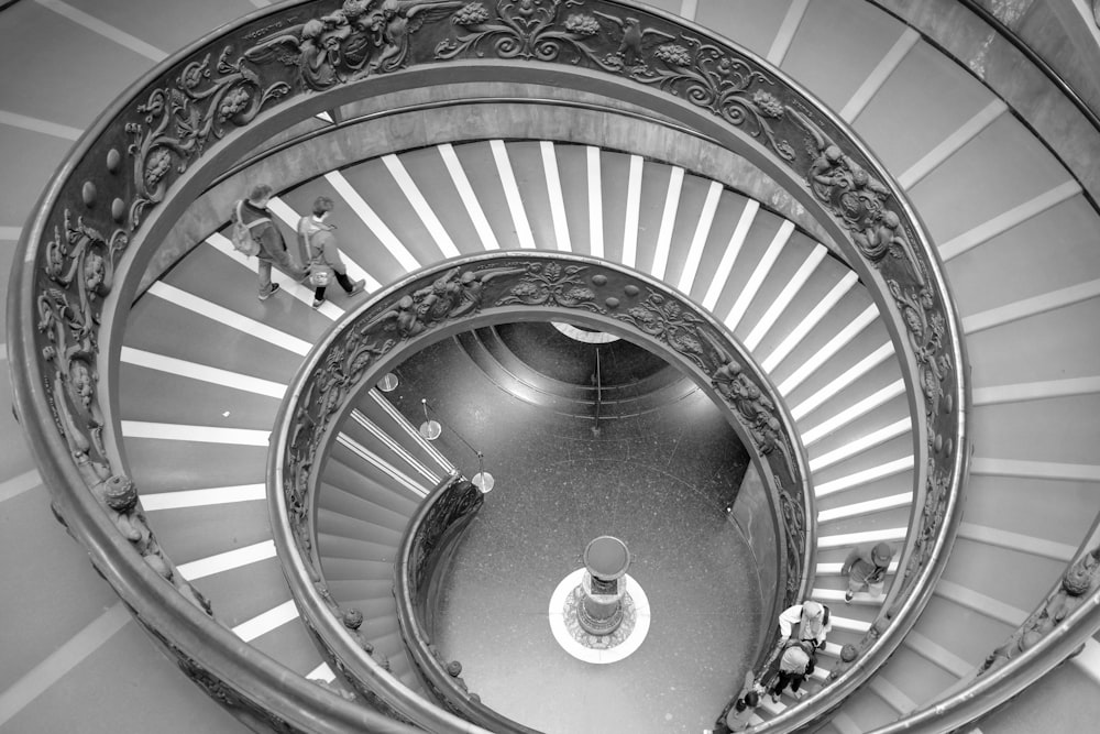 a black and white photo of a spiral staircase