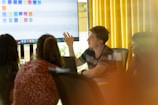 a man giving a presentation to a group of people