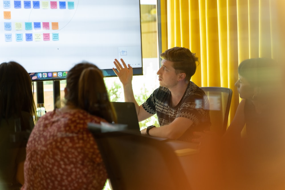 a man giving a presentation to a group of people