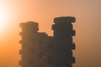 a very tall building with a lot of balconies on top of it