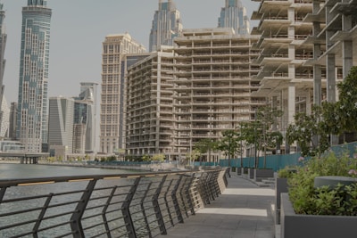 a row of buildings next to a body of water