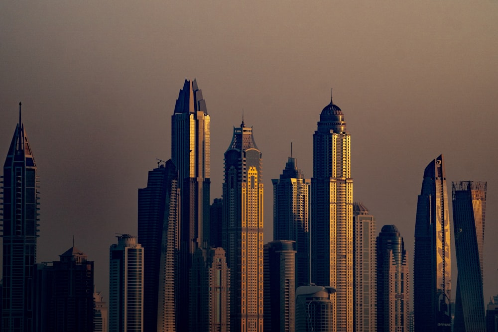 a plane flying over a large city with tall buildings