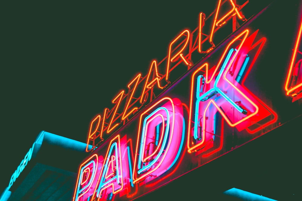 a neon sign for a bar called dark