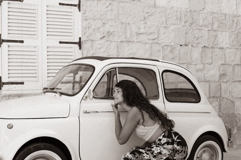 Stylish Greek beauty by luxury car