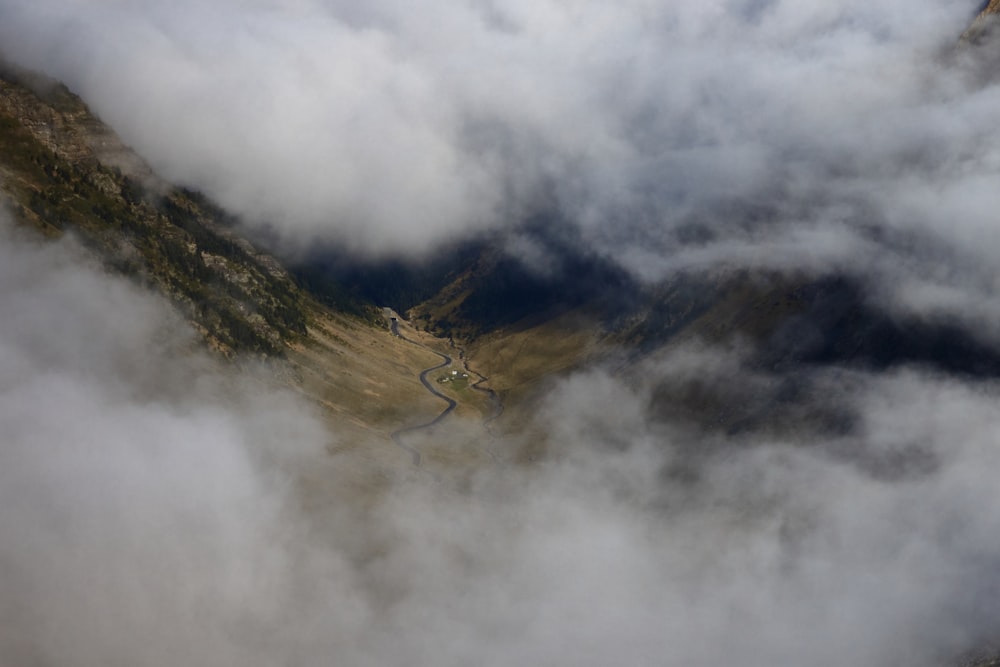 a view of a mountain with a lot of clouds