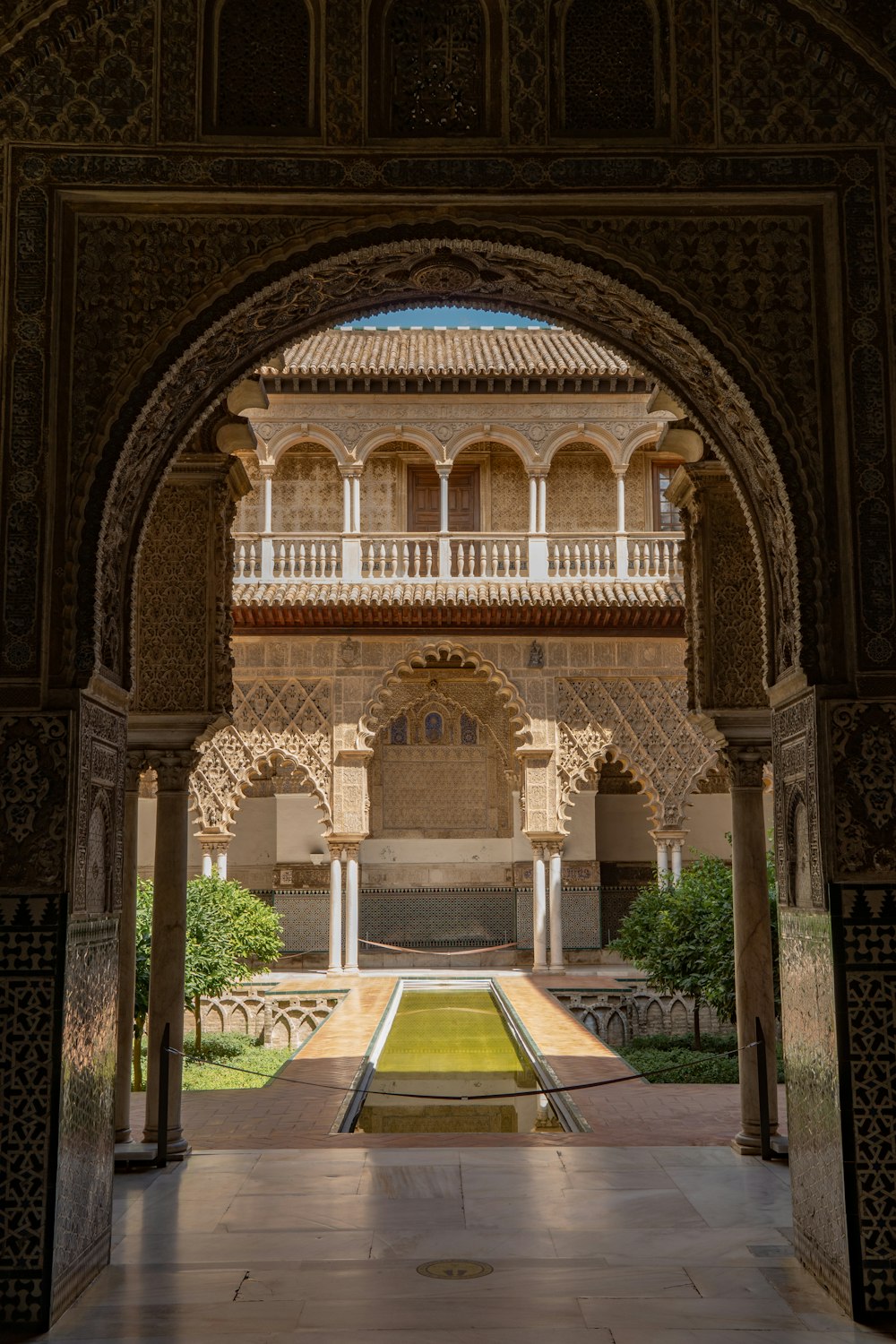 a large building with a fountain in the middle of it