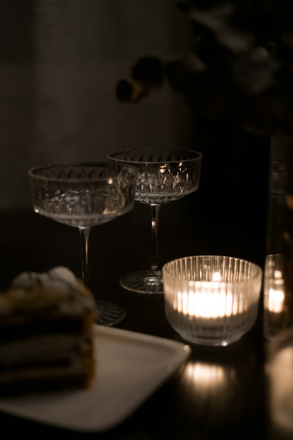 a couple of glasses sitting on top of a table