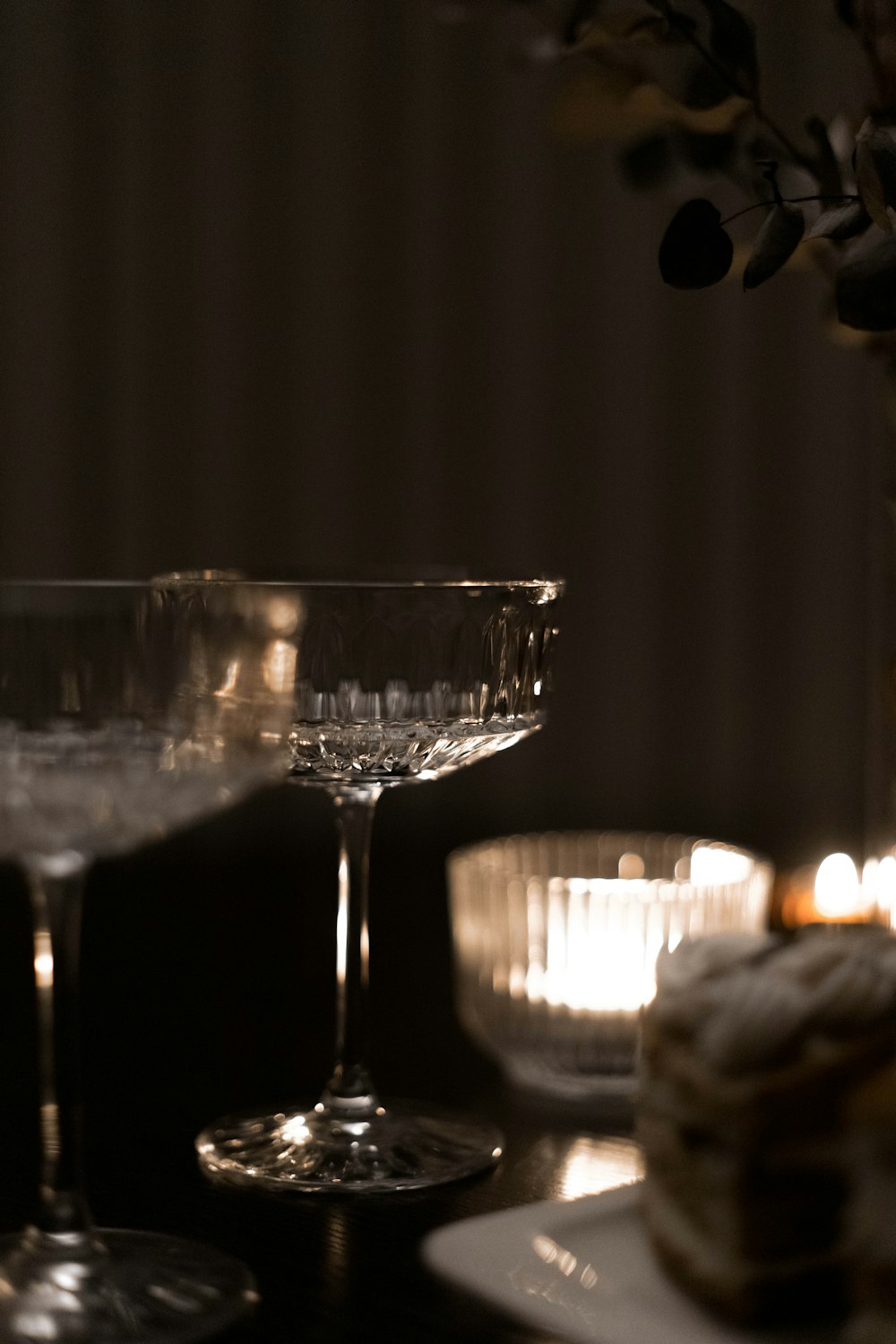 a table topped with two glasses of wine