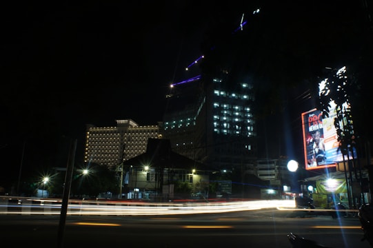 A digital shield graphic overlaying a cityscape at night, symbolizing cybersecurity protection.